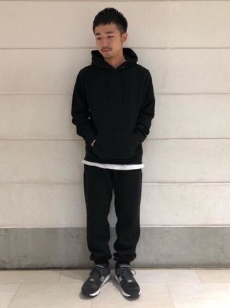 Black Track Suit Outfits For Men: Dress in a black track suit and a white crew-neck t-shirt to pull together a laid-back and functional ensemble. Black and white athletic shoes are a nice choice to complete your ensemble.