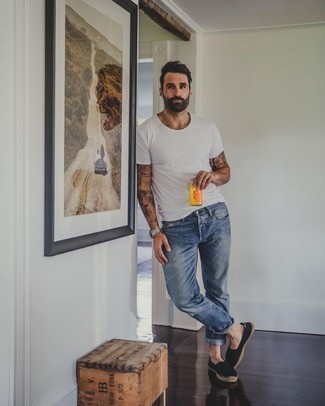 1200+ Hot Weather Outfits For Men: This pairing of a white crew-neck t-shirt and blue jeans is indisputable proof that a safe casual getup can still be seriously dapper. You can take a classic approach with footwear and complement this outfit with black canvas espadrilles.