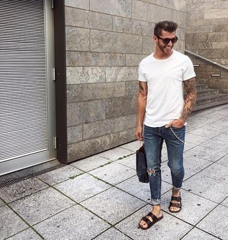 Dark Brown Leather Sandals Outfits For Men: This pairing of a white crew-neck t-shirt and blue ripped jeans is solid proof that a safe casual outfit doesn't have to be boring. Add a little kick to the look with dark brown leather sandals.