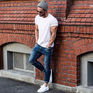 Grey Beanie Outfits For Men: Rock a white crew-neck t-shirt with a grey beanie for an off-duty look with a twist. Finishing off with white leather low top sneakers is a simple way to introduce some extra zing to your getup.