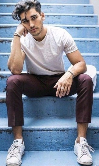 Burgundy Chinos Casual Outfits: For a look that delivers function and dapperness, make a white crew-neck t-shirt and burgundy chinos your outfit choice. For extra style points, introduce white leather low top sneakers to your getup.