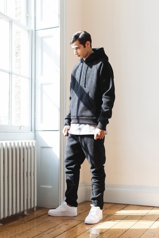 Charcoal Track Suit Outfits For Men: A charcoal track suit looks especially nice when paired with a white crew-neck t-shirt in a laid-back getup. White leather low top sneakers are an effortless way to breathe a dose of sophistication into this outfit.