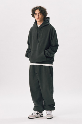 Olive Track Suit Outfits For Men: For a laid-back and cool look, pair an olive track suit with a white crew-neck t-shirt — these items play pretty good together. Finishing with a pair of white and black leather low top sneakers is an effortless way to give an extra dose of style to this ensemble.