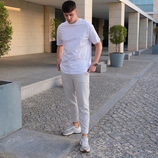 Silver Athletic Shoes Outfits For Men: This combo of a white crew-neck t-shirt and grey chinos is a good ensemble for when it's time to clock off. Tone down your ensemble by finishing with silver athletic shoes.