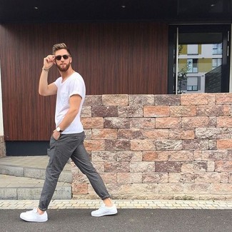 White Low Top Sneakers Outfits For Men: Such items as a white crew-neck t-shirt and grey chinos are an easy way to inject some cool into your day-to-day casual routine. Introduce white low top sneakers to this getup and off you go looking awesome.