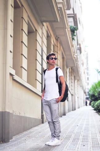 Men's White Crew-neck T-shirt, Grey Chinos, White Low Top Sneakers, Black Leather Backpack
