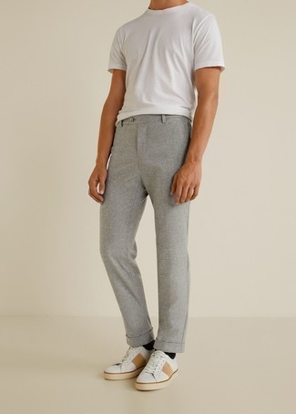 Grey Chinos Outfits: A white crew-neck t-shirt and grey chinos are a good combo worth having in your casual styling arsenal. Add a pair of white leather low top sneakers to the equation and the whole ensemble will come together perfectly.