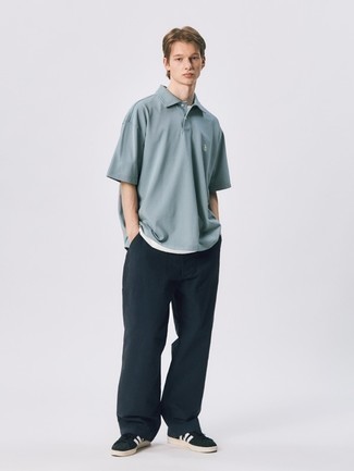 Light Blue Polo Outfits For Men: A light blue polo and black chinos are totally worth being on your list of menswear staples. Black and white suede low top sneakers are a winning footwear style that's full of personality.