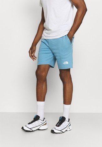 Light Blue Sports Shorts Outfits For Men: This city casual combo of a white crew-neck t-shirt and light blue sports shorts is very easy to throw together without a second thought, helping you look stylish and prepared for anything without spending too much time digging through your wardrobe. For maximum style effect, introduce a pair of white and black athletic shoes to the mix.