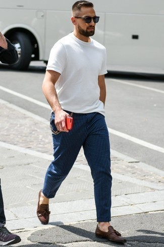 Blue Vertical Striped Chinos Outfits: If you want take your casual fashion game to a new height, rock a white crew-neck t-shirt with blue vertical striped chinos. Complement this ensemble with dark brown leather tassel loafers to instantly change up the ensemble.
