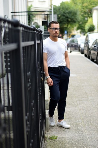 Navy Chinos with Crew-neck T-shirt Hot Weather Outfits In Their 30s: Go for a straightforward yet casually cool option in a crew-neck t-shirt and navy chinos. If you're wondering how to finish off, complete your ensemble with white canvas low top sneakers. This getup demonstrates how men in their 30s score in the style department.