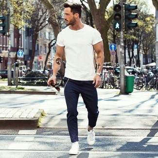 White Plimsolls Outfits For Men: For a casual getup, pair a white crew-neck t-shirt with navy chinos — these two items work beautifully together. When it comes to footwear, this ensemble pairs perfectly with white plimsolls.