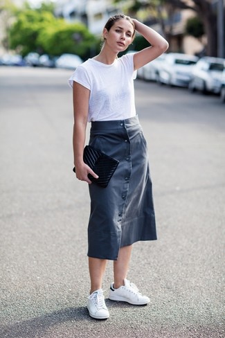 Blue Leather Midi Skirt Outfits: Display your sartorial expertise by combining a white crew-neck t-shirt and a blue leather midi skirt for an off-duty getup. Dial up your look by rocking a pair of white low top sneakers.
