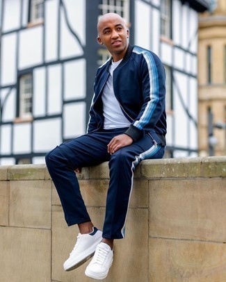 Blue Track Suit Outfits For Men: Flaunt your skills in men's fashion by teaming a blue track suit and a white crew-neck t-shirt for a modern casual ensemble. To introduce some extra depth to your ensemble, add a pair of white and navy leather low top sneakers to the equation.