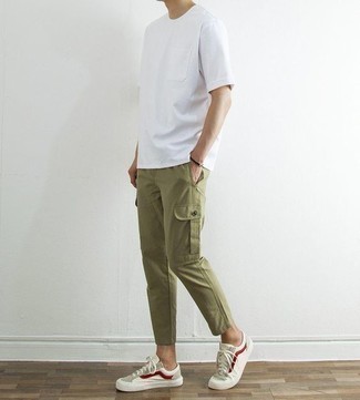 Tan Canvas Low Top Sneakers Outfits For Men: For a casual getup, make a white crew-neck t-shirt and olive cargo pants your outfit choice — these two items play pretty good together. A pair of tan canvas low top sneakers is a savvy pick to finish off this look.