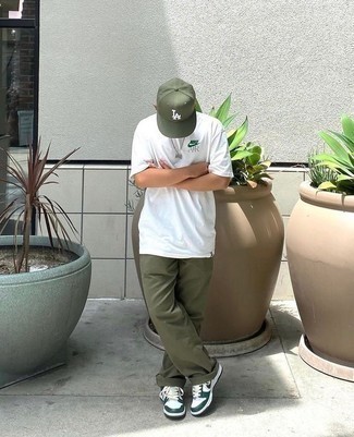Olive Baseball Cap Outfits For Men: No matter where the day takes you, you can always rely on this relaxed combination of a white crew-neck t-shirt and an olive baseball cap. On the fence about how to complement your outfit? Finish off with white and green leather low top sneakers to amp it up.