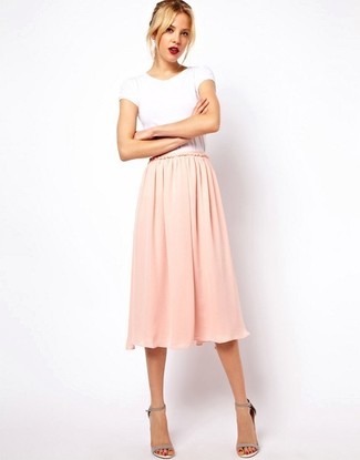 Pink Midi Skirt Outfits: This combination of a white crew-neck t-shirt and a pink midi skirt is hard proof that a simple casual ensemble can still look really interesting. Want to play it up in the footwear department? Introduce a pair of grey leather heeled sandals to the equation.
