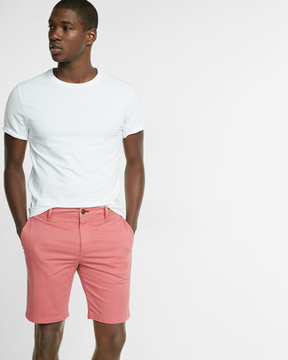 Hot Pink Shorts Outfits For Men: For a relaxed casual look, wear a white crew-neck t-shirt with hot pink shorts — these two items fit really well together.