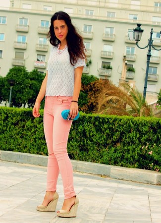 Pink Jeans Outfits For Women: Such staples as a white lace crew-neck t-shirt and pink jeans are the ideal way to inject some cool into your off-duty styling collection. Let your sartorial chops truly shine by finishing off this outfit with a pair of tan leather wedge sandals.