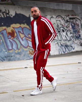 Red Track Suit Outfits For Men: Remain stylish on weekend days in a red track suit and a white crew-neck t-shirt. Finishing with white leather low top sneakers is a guaranteed way to give a hint of elegance to this ensemble.