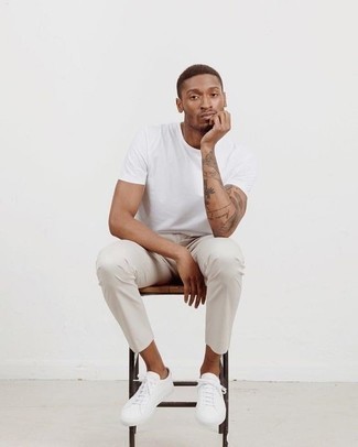 White Chinos with White Low Top Sneakers Hot Weather Outfits: This casual combination of a white crew-neck t-shirt and white chinos is a goofproof option when you need to look stylish in a flash. White low top sneakers tie the outfit together.