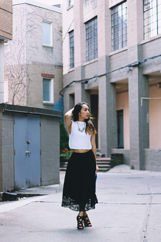 Black Lace Maxi Skirt Outfits: Go for a white knit cropped top and a black lace maxi skirt for a modern twist on day-to-day style. To give this look a dressier feel, complement your getup with black suede heeled sandals.