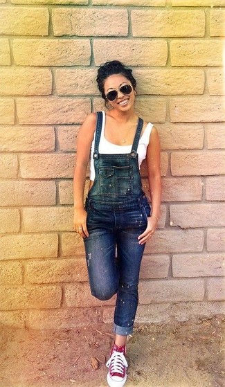 Overalls Outfits: This combination of a white cropped top and overalls is hard proof that a straightforward off-duty getup doesn't have to be boring. When it comes to footwear, this outfit is finished off wonderfully with red high top sneakers.