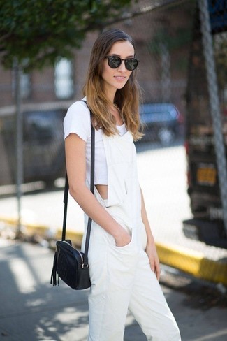 Overalls Outfits: The combo of a white cropped top and overalls makes this a solid relaxed outfit.