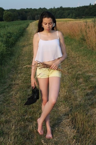 Cropped Top Outfits: You'll be amazed at how extremely easy it is to pull together this casual outfit. Just a cropped top worn with yellow shorts. Bring an elegant twist to this getup by rocking black suede heeled sandals.