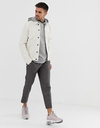 Charcoal Plaid Chinos Outfits: This is hard proof that a white denim jacket and charcoal plaid chinos are amazing when combined together in a laid-back ensemble. And if you wish to instantly dress down your getup with one item, introduce pink athletic shoes to this outfit.
