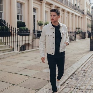 White and Black Denim Jacket Outfits For Men: Go for a pared down but at the same time casually dapper choice in a white and black denim jacket and black skinny jeans. If you're not sure how to finish, introduce a pair of white canvas low top sneakers to the mix.