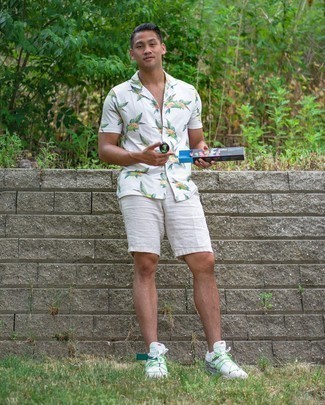 Green Athletic Shoes Outfits For Men: For a cool and casual outfit, pair a white floral short sleeve shirt with white linen shorts — these pieces work really well together. Green athletic shoes can easily tone down an all-too-refined outfit.