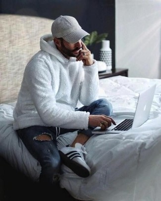 White Fleece Hoodie Outfits For Men: If it's comfort and functionality that you're looking for in an ensemble, dress in a white fleece hoodie and blue ripped jeans. White and black canvas low top sneakers are a simple way to add a little kick to the ensemble.