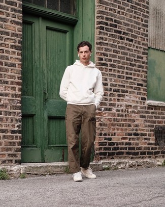 White Sweater Outfits For Men: Reach for a white sweater and brown chinos to feel absolutely confident in yourself and look laid-back and cool. If you want to immediately step up your outfit with a pair of shoes, why not introduce white canvas high top sneakers to the mix?