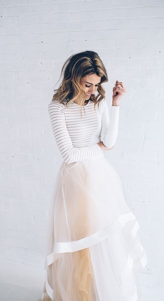 White Tulle Maxi Skirt Outfits: You'll be surprised at how easy it is to get dressed like this. Just a white horizontal striped long sleeve t-shirt worn with a white tulle maxi skirt.