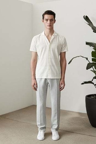 Grey Chinos Outfits: A white horizontal striped short sleeve shirt and grey chinos have become indispensable casual styles for most guys. When in doubt about what to wear on the footwear front, introduce a pair of white canvas low top sneakers to the equation.