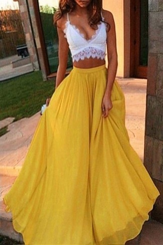 Gold Pleated Maxi Skirt Outfits: A white lace cropped top and a gold pleated maxi skirt are a nice combo that will easily take you throughout the day.