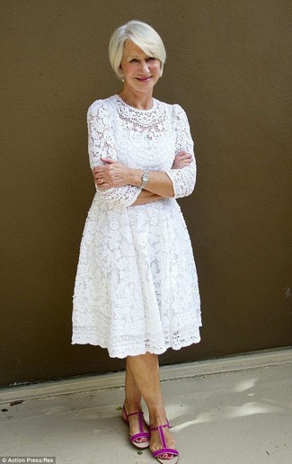 Reach for a white lace midi dress to put together an interesting and modern-looking off-duty ensemble. Take your ensemble in a more casual direction by sporting hot pink suede flat sandals.