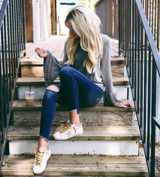 Women's White Leather Low Top Sneakers, Navy Ripped Skinny Jeans, Grey Crew-neck Sweater