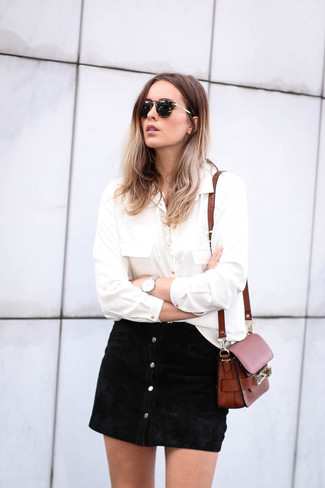 Black Button Skirt Outfits: This combination of a white long sleeve blouse and a black button skirt will cement your sartorial chops even on off-duty days.