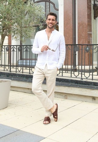 Brown Leather Sandals Outfits For Men: This pairing of a white long sleeve shirt and beige chinos is super versatile and creates instant appeal. On the shoe front, go for something on the relaxed end of the spectrum and complete your outfit with a pair of brown leather sandals.