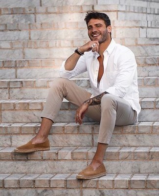 Tan Suede Espadrilles Outfits For Men: A white long sleeve shirt and beige chinos are a cool pairing to keep in your menswear collection. A pair of tan suede espadrilles serves as the glue that will bring your ensemble together.