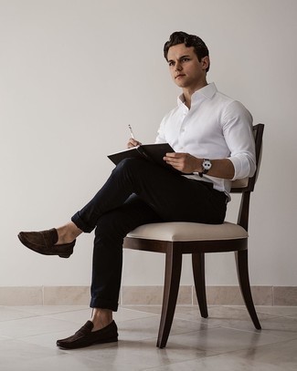 Dark Brown Suede Loafers Outfits For Men: Reach for a white long sleeve shirt and black chinos if you wish to look casual and cool without exerting much effort. In the shoe department, go for something on the classier end of the spectrum and finish off this outfit with dark brown suede loafers.