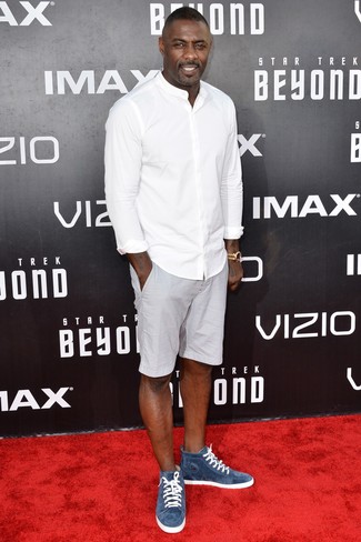 Idris Elba wearing White Long Sleeve Shirt, Grey Shorts, Blue Suede High Top Sneakers, Gold Watch
