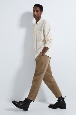 White Corduroy Long Sleeve Shirt Outfits For Men: A white corduroy long sleeve shirt and khaki corduroy chinos will bring serious style to your current off-duty fashion mix. And if you need to effortlessly step up this ensemble with shoes, add a pair of black leather casual boots to the equation.