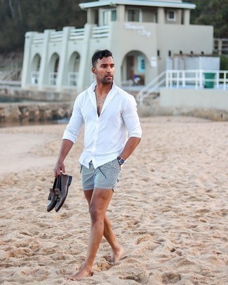 Swim Shorts Outfits: A white long sleeve shirt and swim shorts are a wonderful pairing worth integrating into your daily casual rotation. Feeling brave? Switch things up by rounding off with dark brown leather tassel loafers.