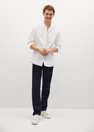 White Long Sleeve Shirt Outfits For Men: A stylish pairing of a white long sleeve shirt and navy jeans will bring confidence and you'll carry yourself with more self-assurance. When not sure as to what to wear in the shoe department, introduce white canvas low top sneakers to your look.