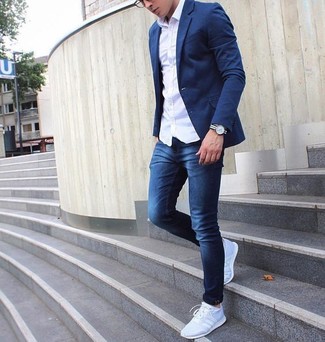 Navy Skinny Jeans Outfits For Men: For a sharp ensemble without the need to sacrifice on practicality, we turn to this combination of a white long sleeve shirt and navy skinny jeans. Bring a fun vibe to this ensemble by sporting grey athletic shoes.