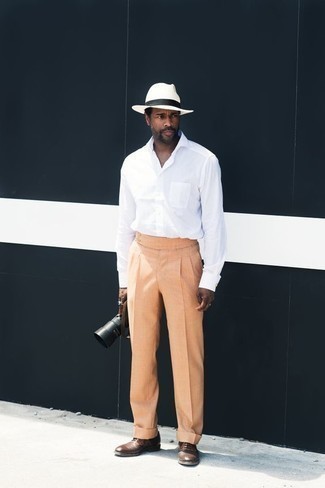 Mustard Dress Pants Outfits For Men: This combination of a white long sleeve shirt and mustard dress pants can only be described as ridiculously stylish and elegant. Brown leather oxford shoes will bring a more sophisticated twist to your outfit.