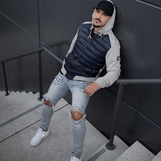 Men's Black Baseball Cap, White Canvas Low Top Sneakers, Light Blue Ripped Skinny Jeans, Navy Quilted Hoodie